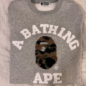 A Bathing Ape Grey College crewneck with “carpet” image and text. Like new cond.